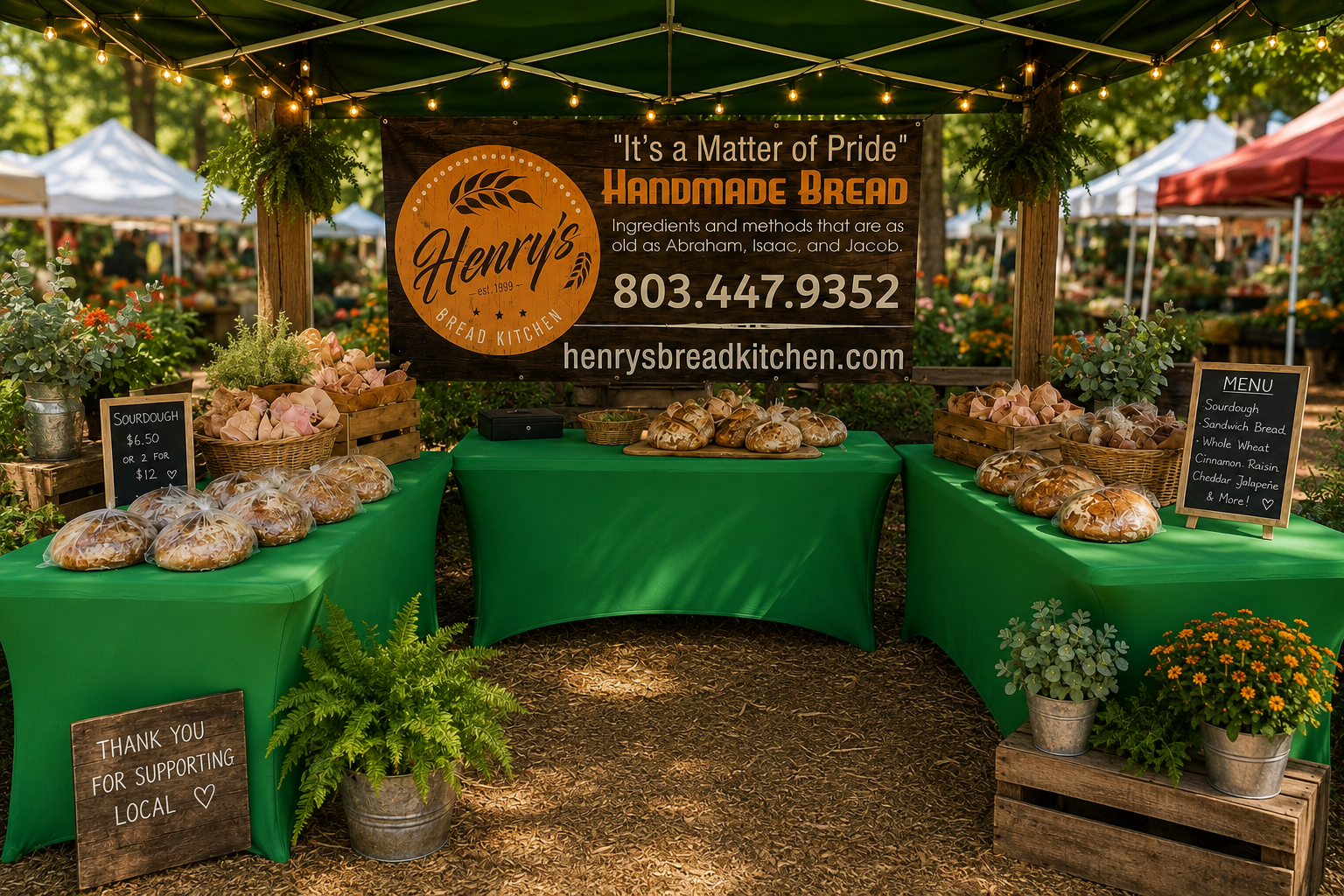 A polished bread market table under a green tent